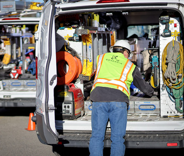 worker looking in van