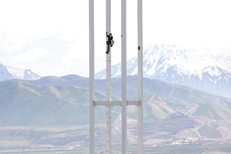Worker climbing pole