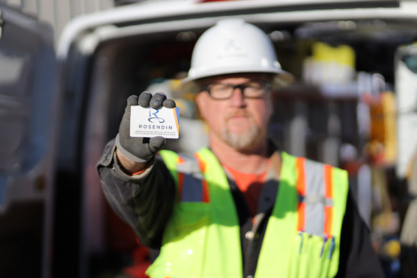 Worker showing card