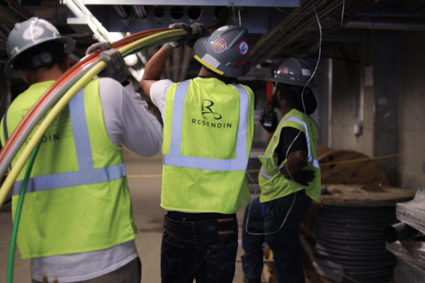 Workers installing components