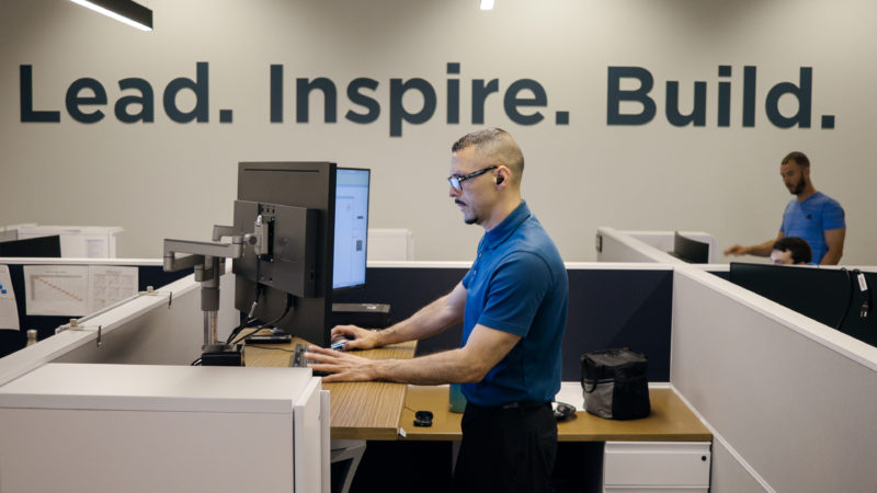 Office worker standing at desk