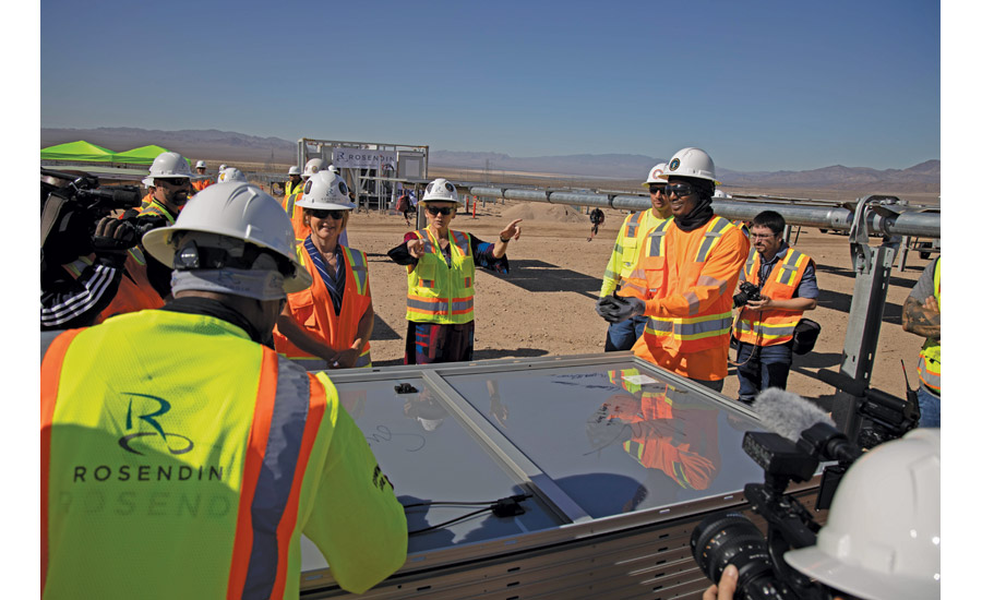 Energy Secretary Granholm talks with Rosendin workers after signing a solar panel
